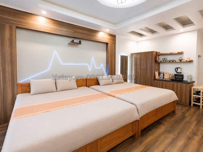 Hai giường lớn và đèn LED hình nhịp tim trong phòng NEON X Stay